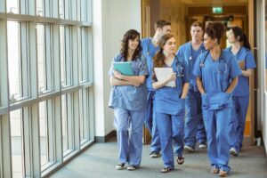 Medical students walking through corridor 385687