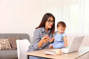 Stay,At,Home,Mom,Working,Remotely,On,Laptop,While,Taking